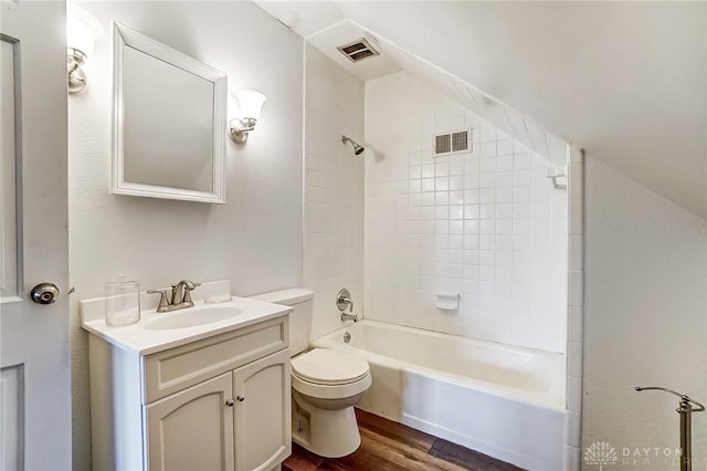 full bathroom with visible vents, vanity, toilet, and wood finished floors