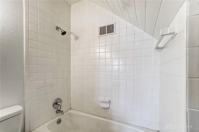 bathroom with  shower combination, visible vents, and toilet