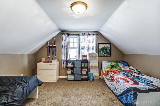 carpeted bedroom featuring lofted ceiling