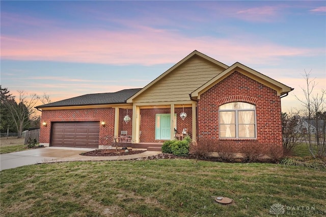 ranch-style home with a front yard, brick siding, driveway, and an attached garage