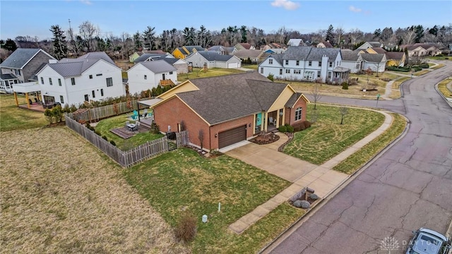 birds eye view of property with a residential view