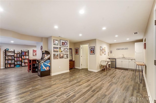 game room featuring baseboards, wood finished floors, visible vents, and recessed lighting