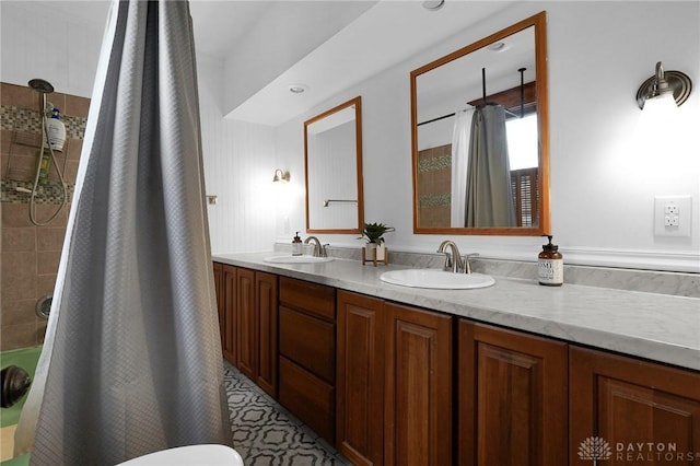 bathroom with double vanity, a sink, and shower / bathtub combination with curtain