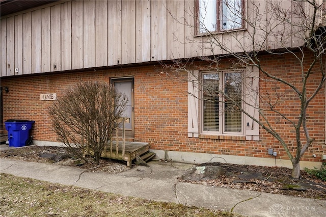 view of home's exterior with brick siding