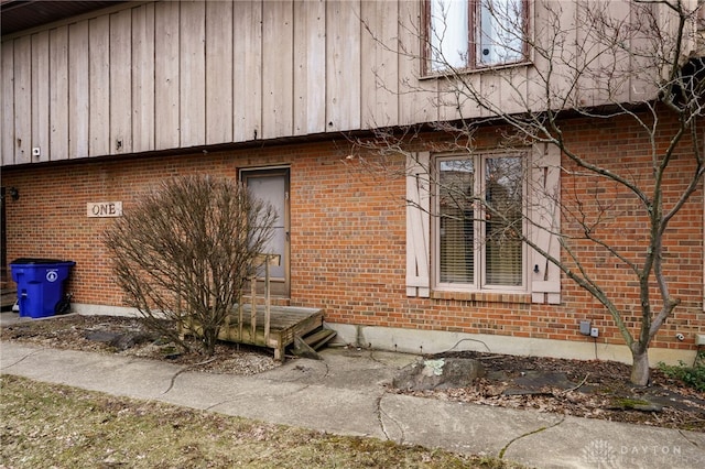 view of property exterior with brick siding
