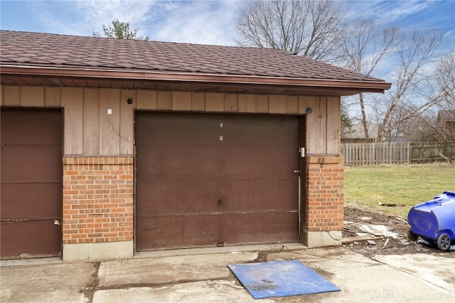 garage with fence