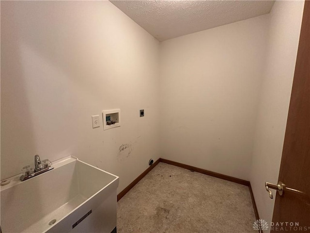 washroom with washer hookup, a sink, electric dryer hookup, laundry area, and baseboards