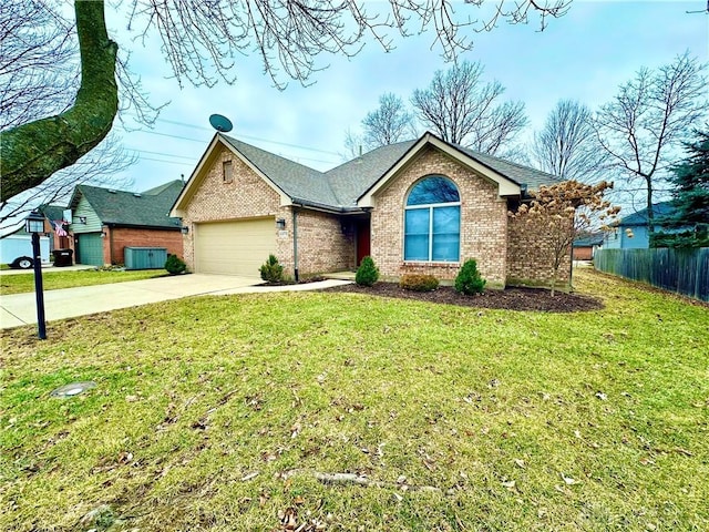 ranch-style home with driveway, brick siding, a front lawn, and fence