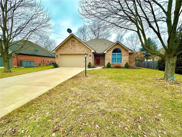 single story home featuring a garage, driveway, fence, a front lawn, and brick siding