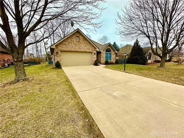 ranch-style house with a garage, driveway, a front lawn, and brick siding