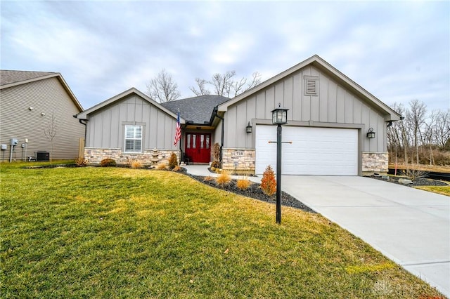 view of front of home with stone siding, central AC unit, board and batten siding, and a front lawn