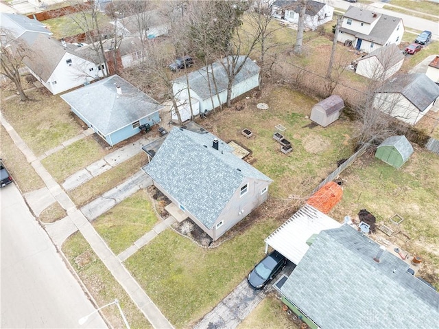 birds eye view of property with a residential view