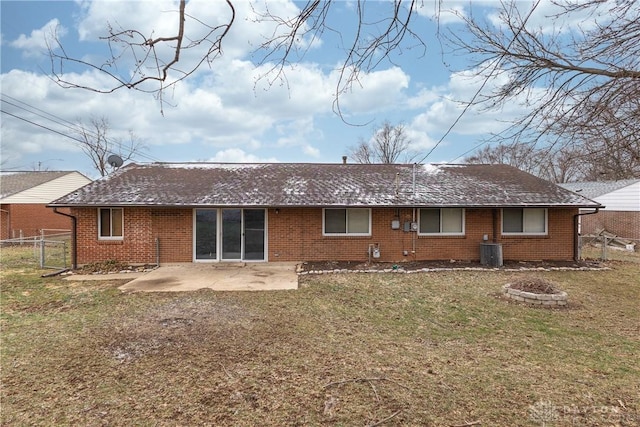 rear view of property featuring cooling unit, a patio area, fence, and a lawn