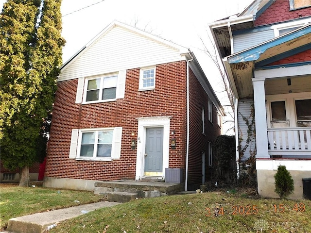 view of front of house with brick siding