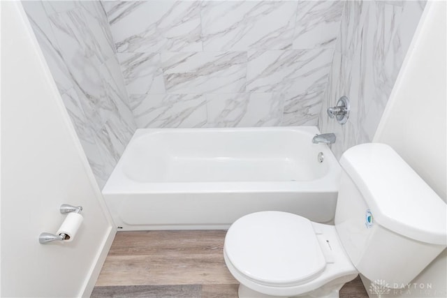 full bathroom with toilet, shower / bathtub combination, and wood finished floors