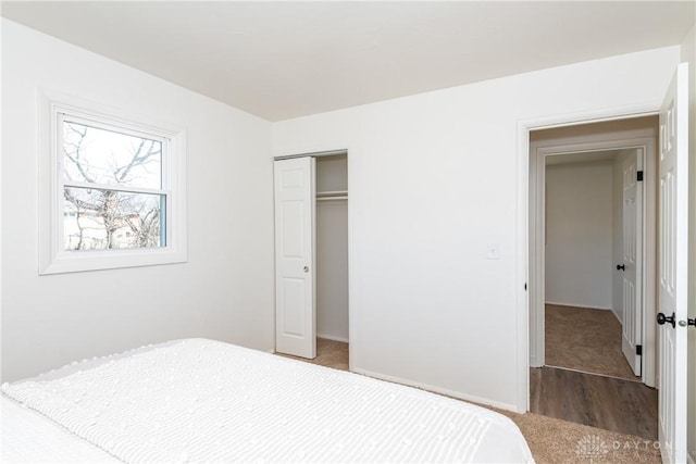 carpeted bedroom with a closet