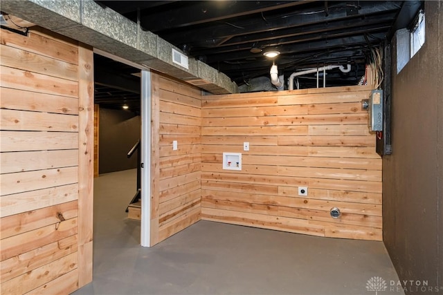 below grade area with visible vents and wood walls