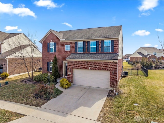 view of front of home featuring a front yard, concrete driveway, brick siding, and fence