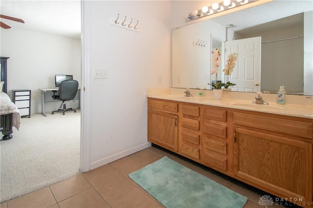 bathroom featuring double vanity, tile patterned flooring, a ceiling fan, and a sink