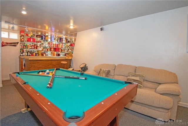 recreation room featuring a bar, billiards, and rail lighting