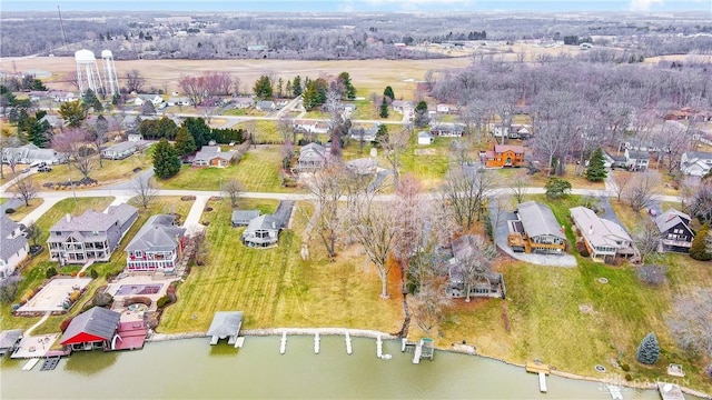 birds eye view of property featuring a water view and a residential view