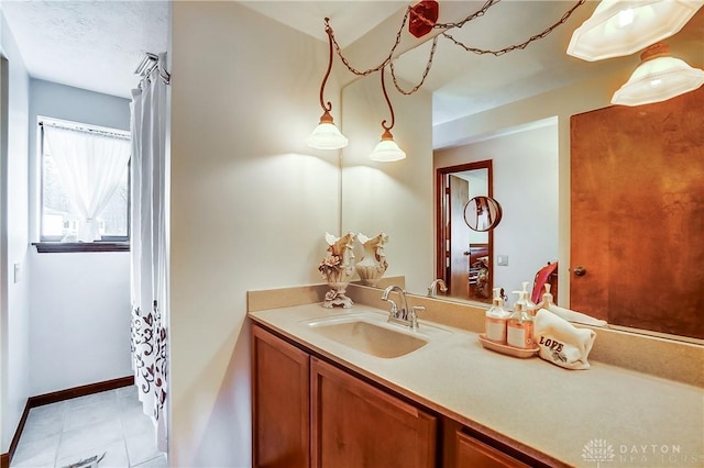 bathroom featuring vanity and baseboards