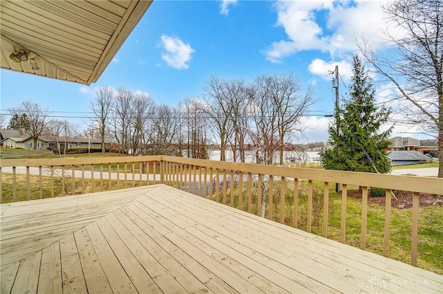 wooden terrace with a residential view