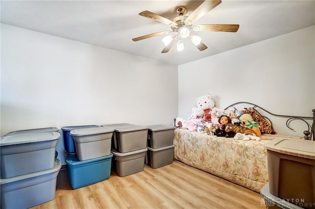 bedroom featuring a ceiling fan and wood finished floors