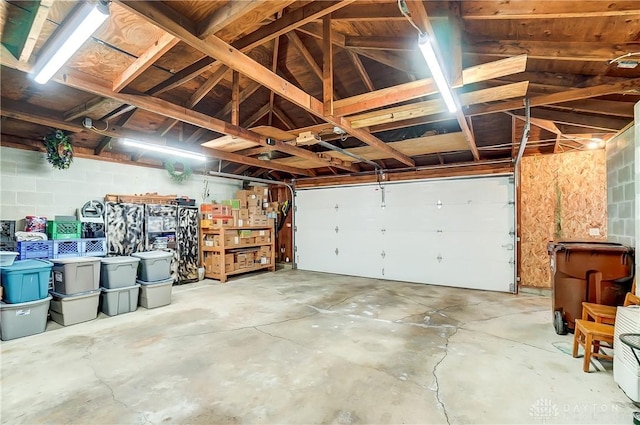 garage with concrete block wall