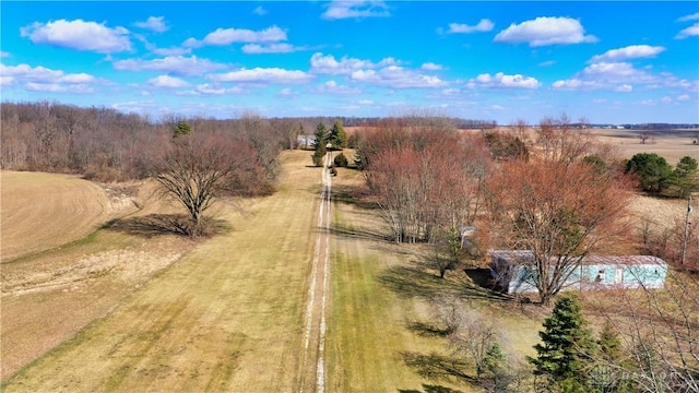 birds eye view of property with a rural view