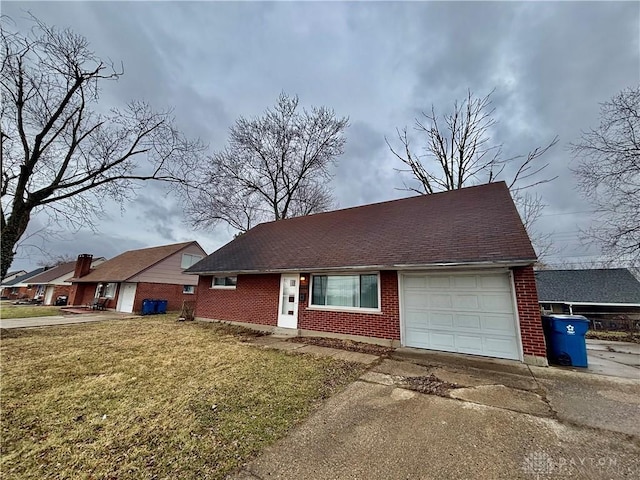 view of front facade featuring a front lawn, roof with shingles, concrete driveway, a garage, and brick siding