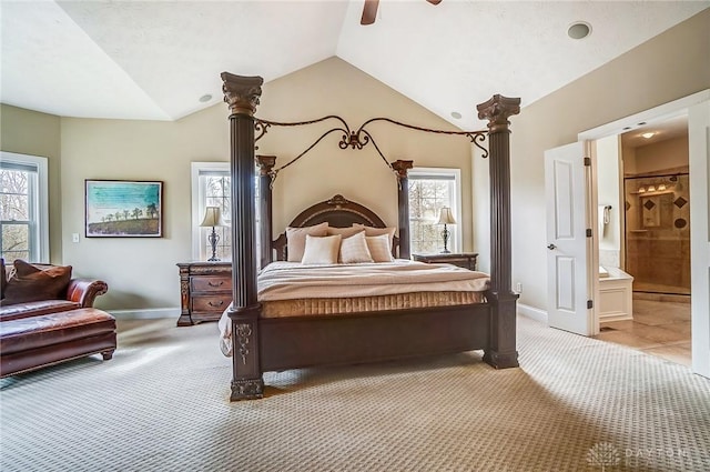 bedroom with lofted ceiling, light carpet, ceiling fan, ensuite bath, and baseboards