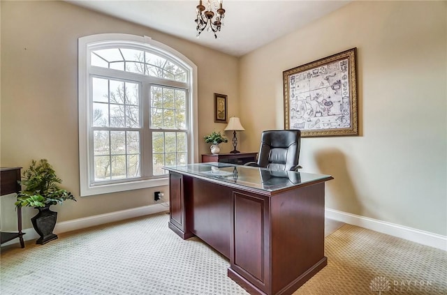 office featuring baseboards, an inviting chandelier, and a healthy amount of sunlight