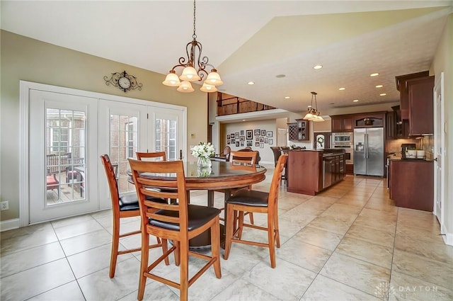 dining room featuring french doors, lofted ceiling, recessed lighting, light tile patterned flooring, and a chandelier