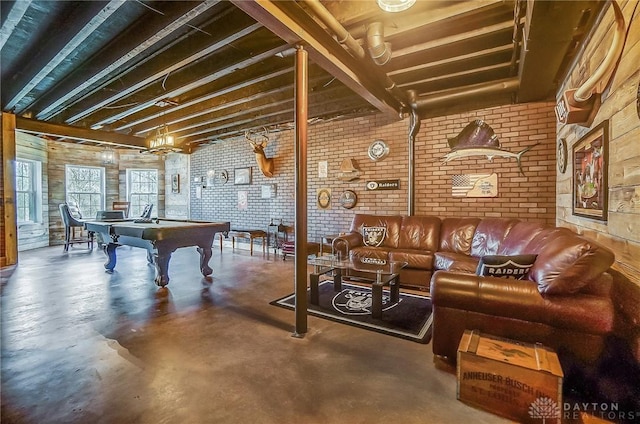 game room featuring concrete flooring, billiards, and brick wall