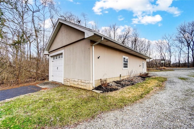 view of side of home featuring driveway