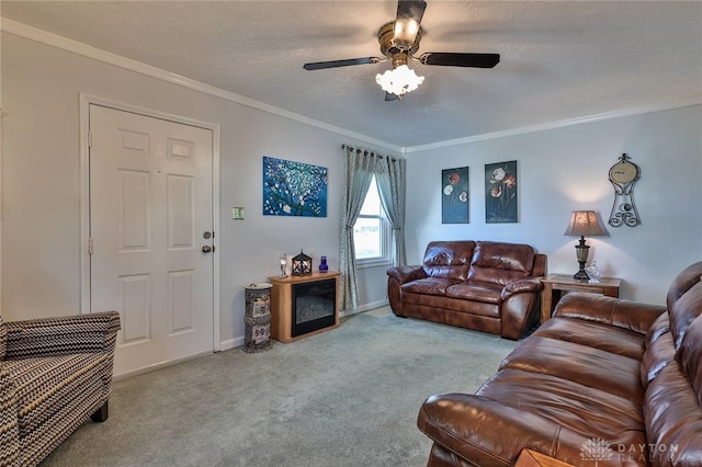 living area featuring a textured ceiling, a ceiling fan, baseboards, carpet, and crown molding