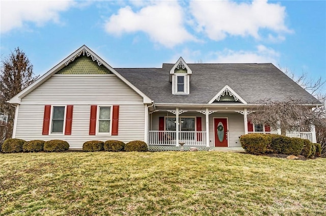 view of front of home with a porch and a front yard