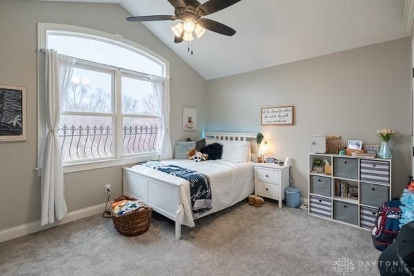 bedroom with baseboards, a ceiling fan, carpet flooring, and vaulted ceiling