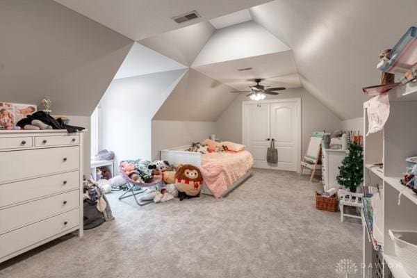 bedroom with visible vents, lofted ceiling, carpet, and a ceiling fan