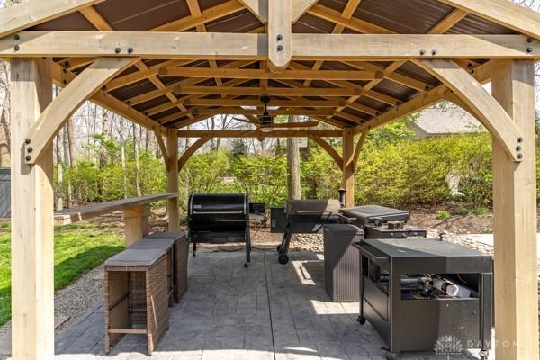 view of patio / terrace featuring a gazebo and a grill