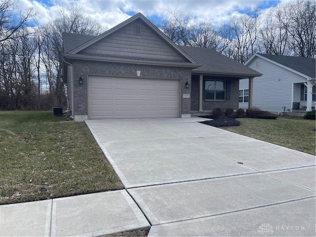 ranch-style home with a front yard, an attached garage, and brick siding