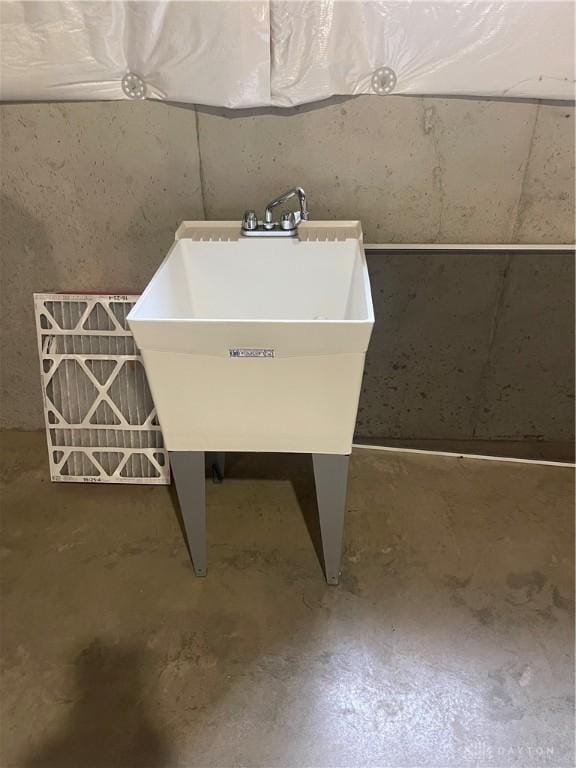 details featuring concrete flooring and a sink