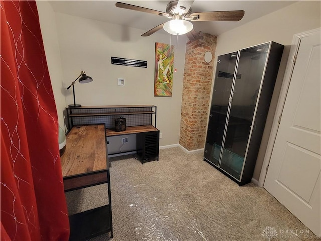 interior space featuring ceiling fan and baseboards