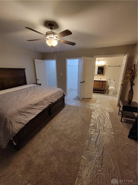 bedroom with connected bathroom and ceiling fan