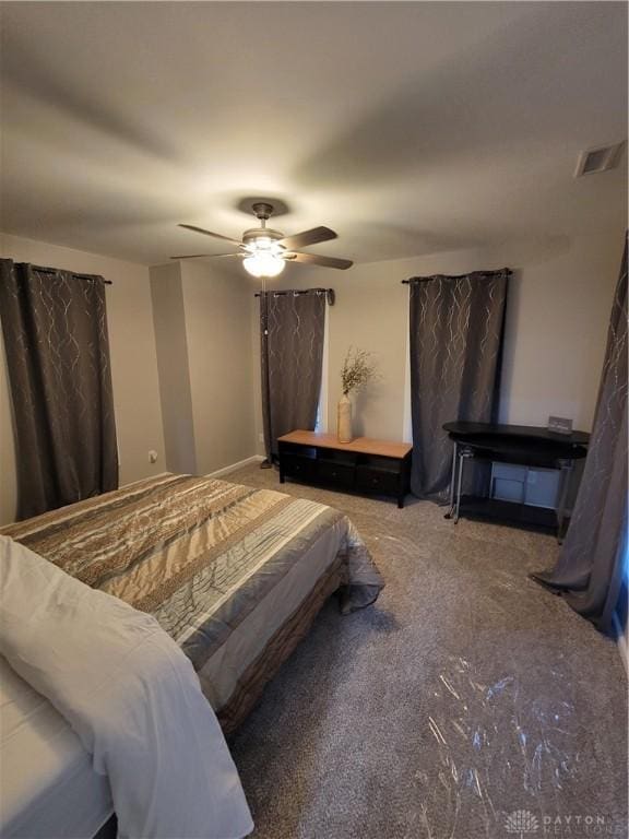 bedroom with carpet flooring, a ceiling fan, and visible vents