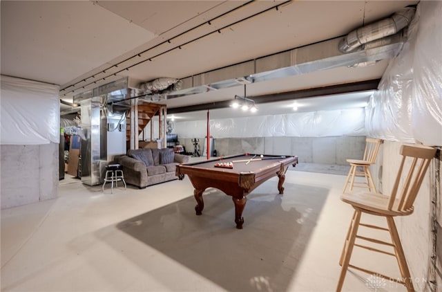 game room with billiards, heating unit, and concrete flooring