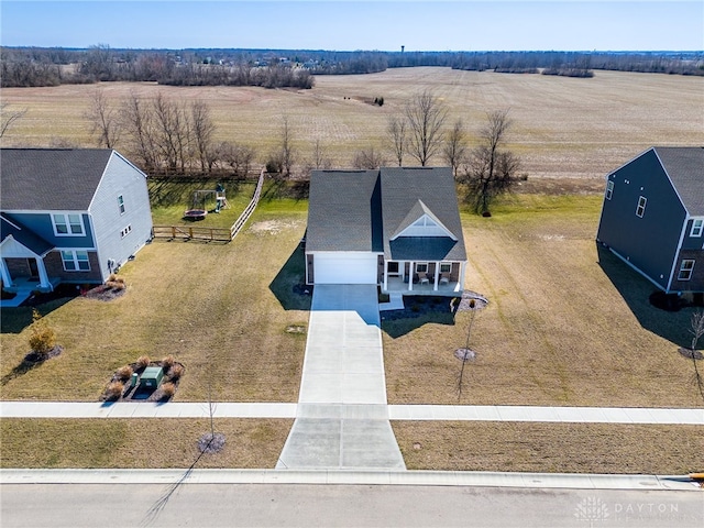 birds eye view of property with a rural view