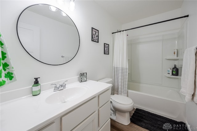 full bathroom featuring wood finished floors, toilet, vanity, and shower / bathtub combination with curtain