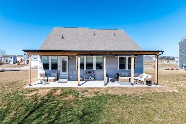 back of house with a patio area, a lawn, outdoor lounge area, and a shingled roof